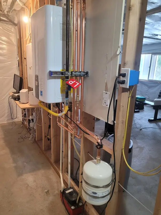 Licensed plumber repairing a kitchen sink in Connersville